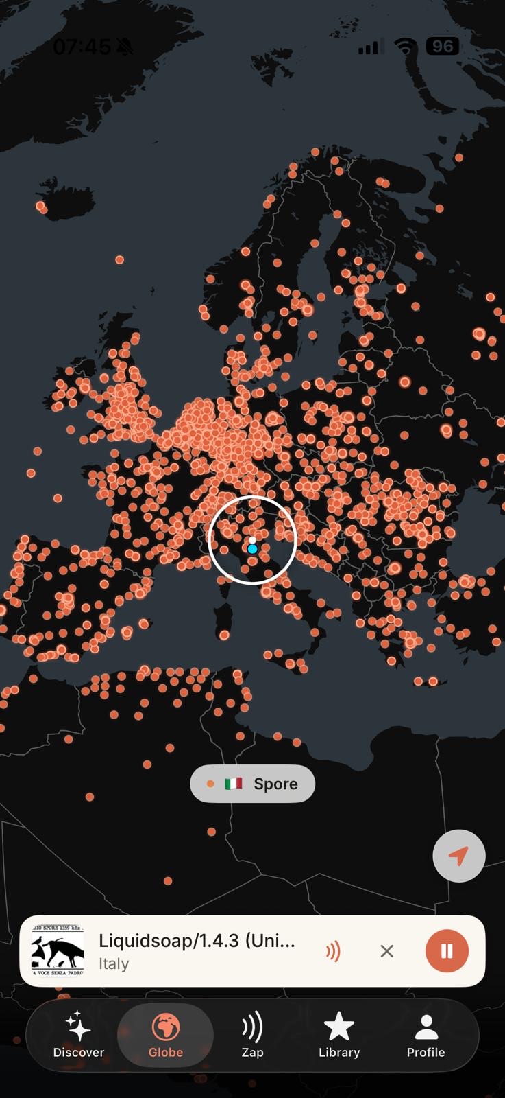 The Globe tab showing thousands of live stations as ember dots across Europe, with the centre reticle tuned to a station in Italy